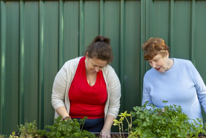 Image of community members gardening